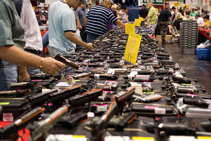 Visitors at a gun show in Houston, Texas (photo by http://flickr.com/photos/glasgows/ (http://flickr.com/photos/glasgows/432945997/) [CC BY 2.0 (http://creativecommons.org/licenses/by/2.0)], via Wikimedia Commons (https://commons.wikimedia.org/wiki/File:Houston_Gun_Show_at_the_George_R._Brown_Convention_Center.jpg)